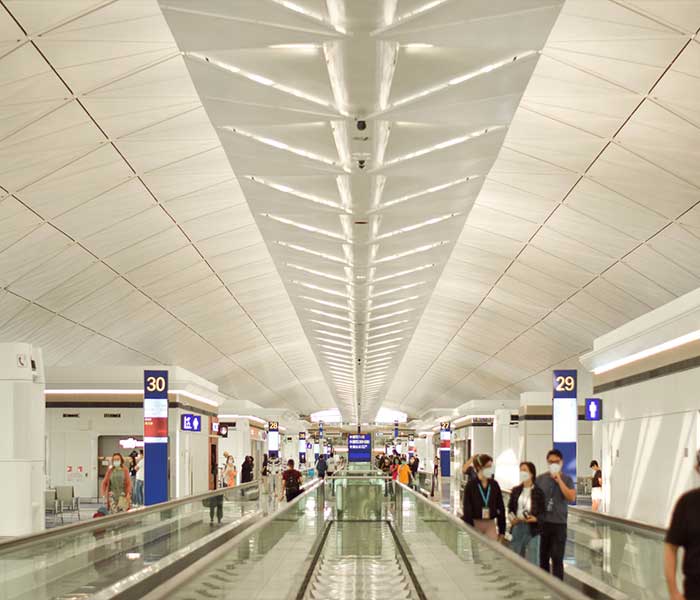 Airport supervisor coordinating with ground staff on the tarmac