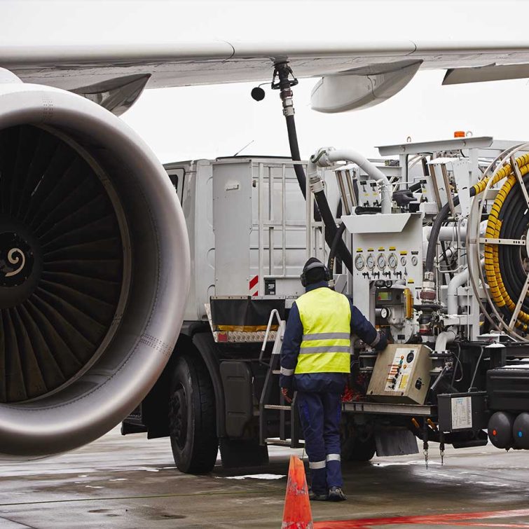 Aircraft being refueled on an airport tarmac by JetStream International