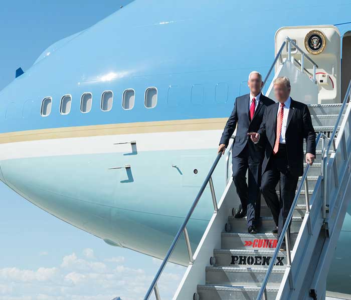 A government aircraft on the tarmac receiving VIP service